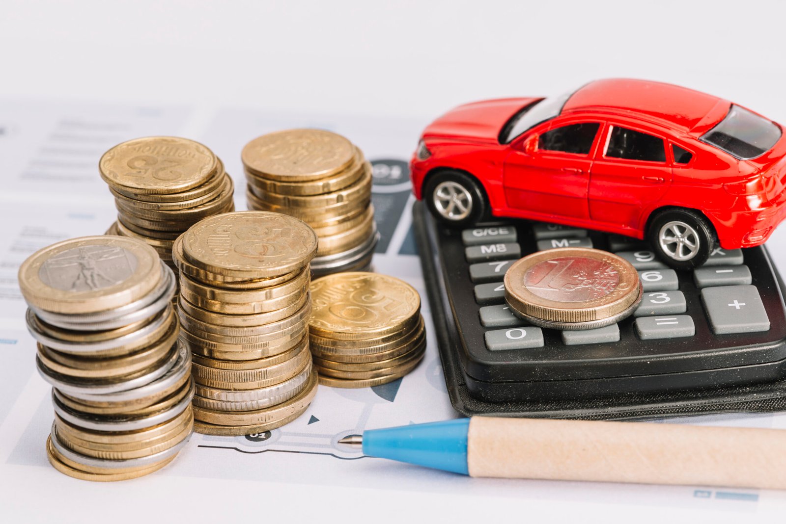 PPF installer table showing a red toy car, ca calculator, a pen and stacked coins